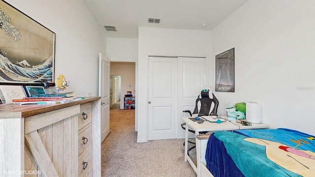 carpeted bedroom with a closet