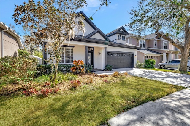 view of front of property with a garage and a front lawn