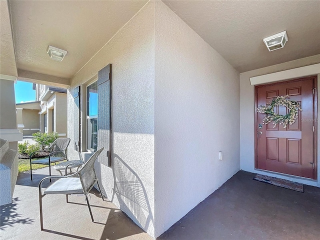 entrance to property featuring covered porch