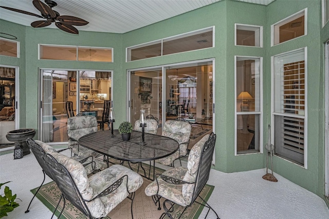 sunroom with a ceiling fan