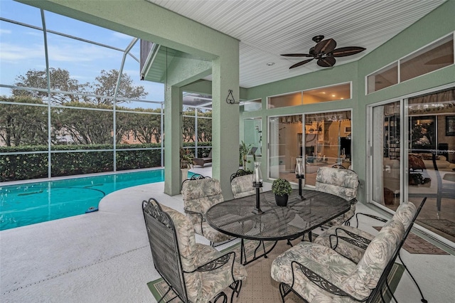 exterior space with ceiling fan and a swimming pool