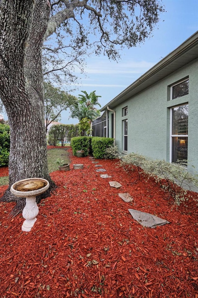 view of yard with a lanai