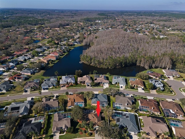 bird's eye view featuring a water view and a residential view