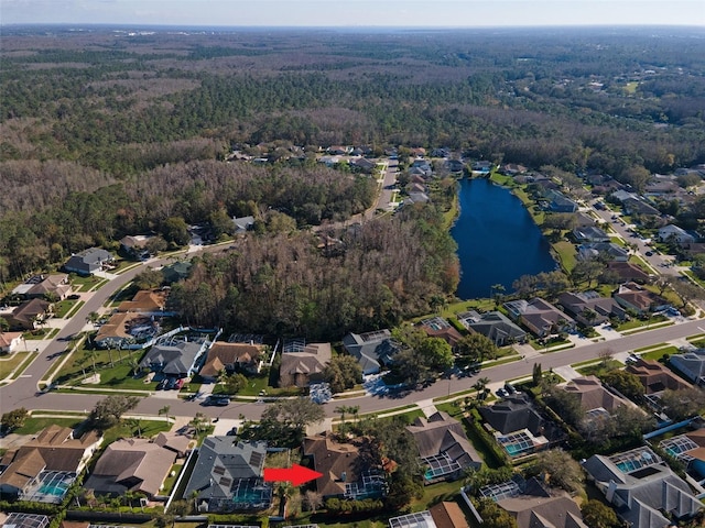 bird's eye view with a residential view, a water view, and a view of trees