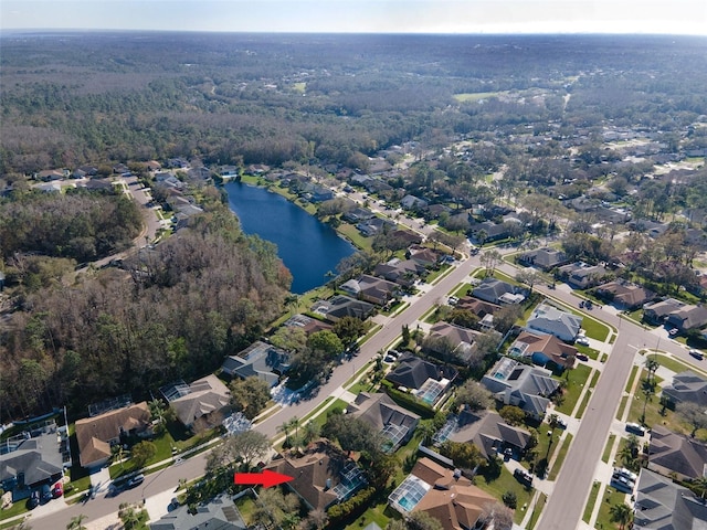 bird's eye view featuring a residential view and a water view