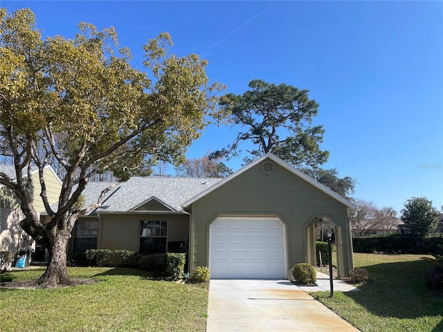 ranch-style house featuring a garage and a front lawn