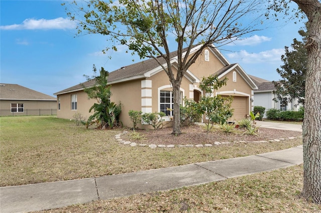 ranch-style house with a garage and a front lawn