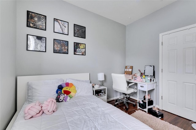 bedroom featuring dark hardwood / wood-style flooring