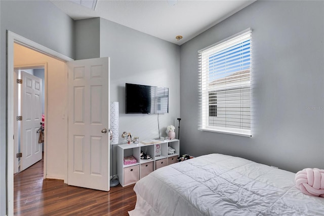 bedroom featuring dark hardwood / wood-style flooring