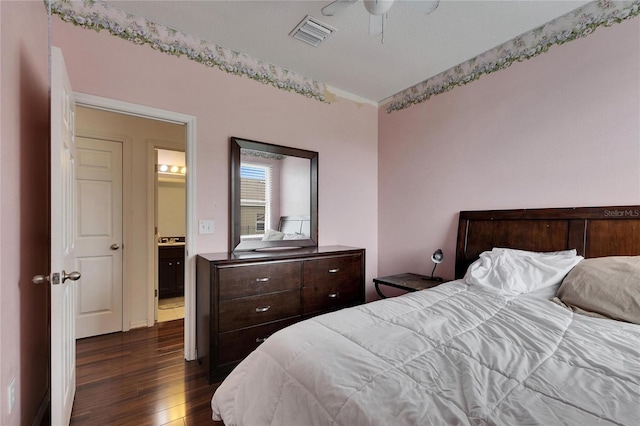 bedroom with ceiling fan and dark hardwood / wood-style floors