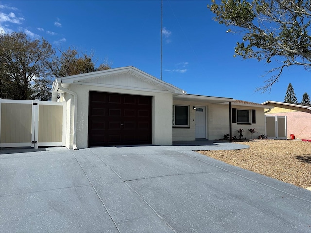 ranch-style house featuring a garage