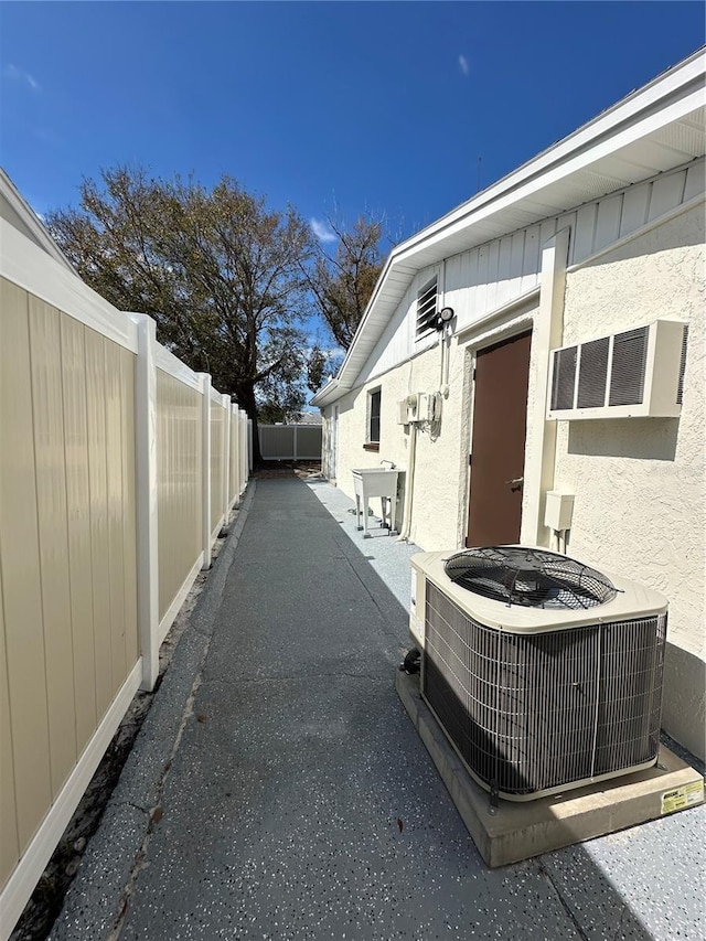 view of home's exterior with a patio and central AC