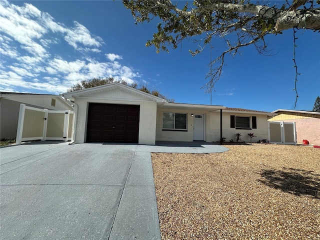 ranch-style house featuring a garage