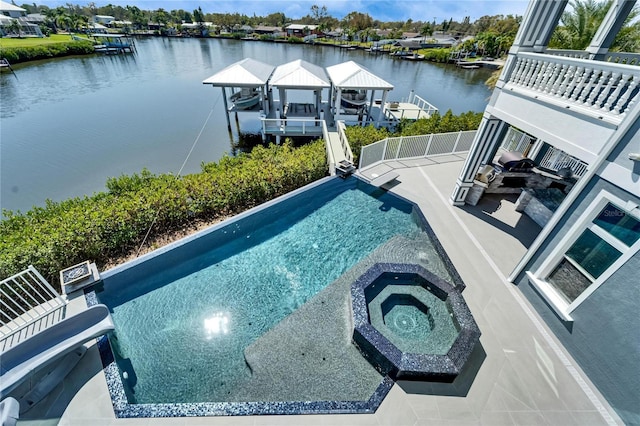 view of pool with boat lift, an in ground hot tub, a water view, a boat dock, and an infinity pool