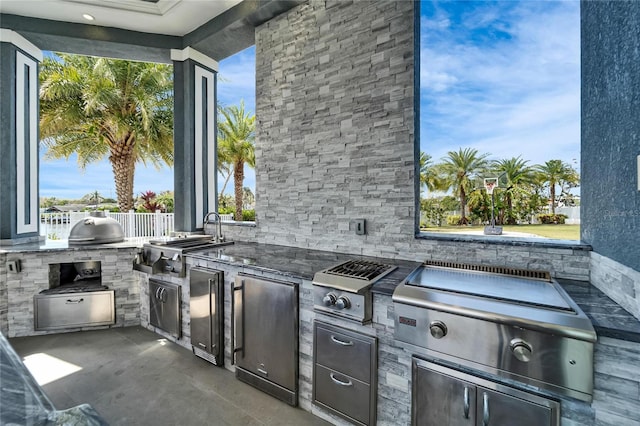 view of patio with grilling area and exterior kitchen