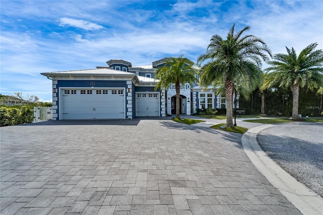 view of front of house featuring a garage and decorative driveway