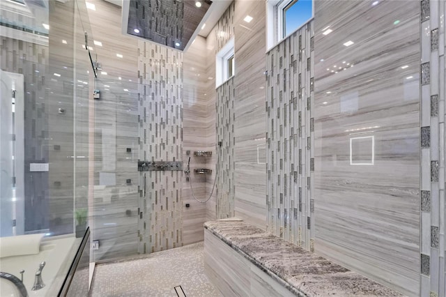 full bathroom featuring tiled shower