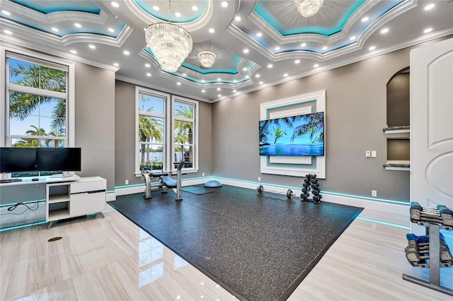 workout area featuring baseboards, a chandelier, ornamental molding, and recessed lighting