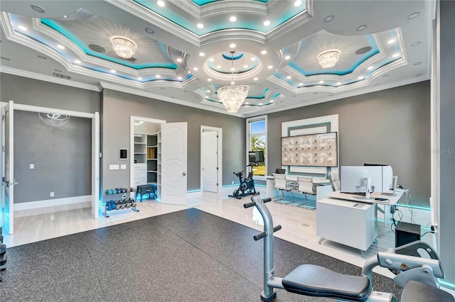 interior space with ornamental molding, a tray ceiling, visible vents, and baseboards