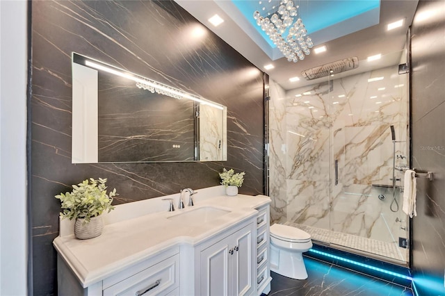 full bathroom featuring toilet, vanity, tile walls, marble finish floor, and a marble finish shower