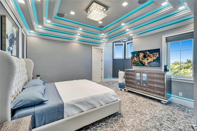 carpeted bedroom with ornamental molding, a raised ceiling, and baseboards