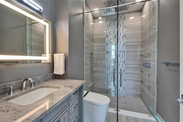 full bath with toilet, a shower stall, and vanity