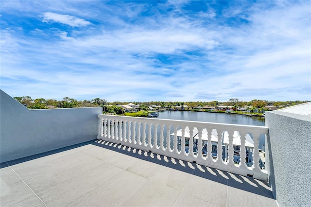 balcony featuring a water view