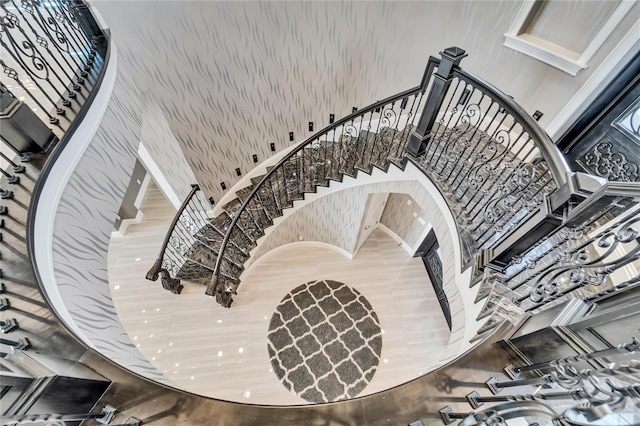 stairs featuring a towering ceiling