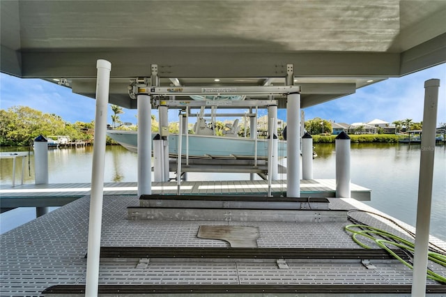 view of dock featuring a water view and boat lift