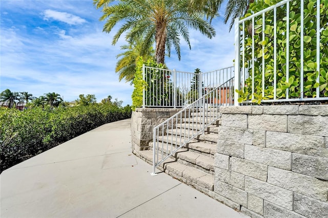 exterior space featuring stairs and a patio