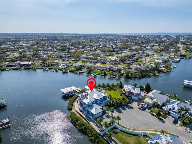 birds eye view of property featuring a water view and a residential view