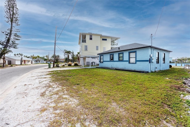 rear view of house with a yard