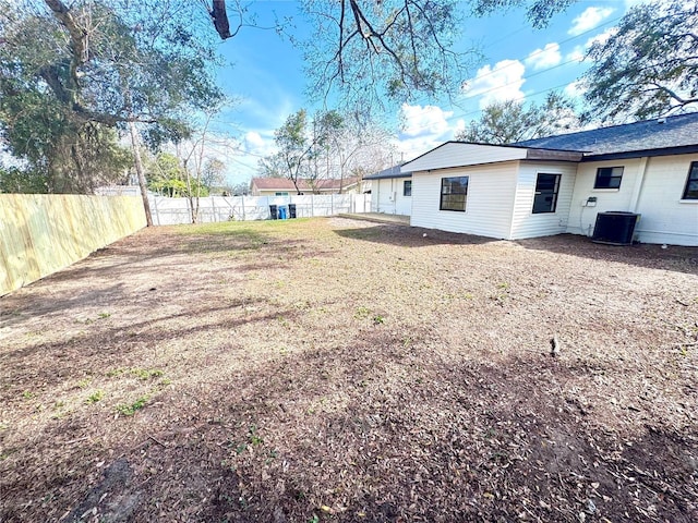 view of yard with central AC