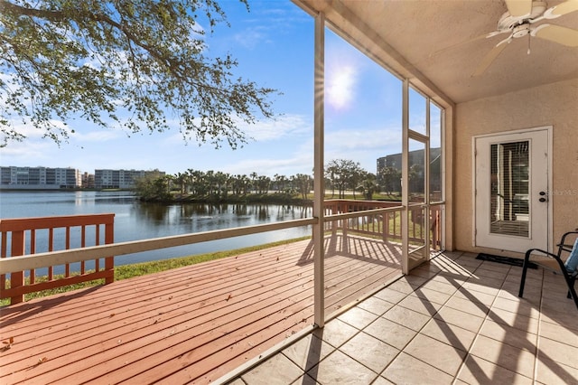 exterior space featuring a water view and ceiling fan