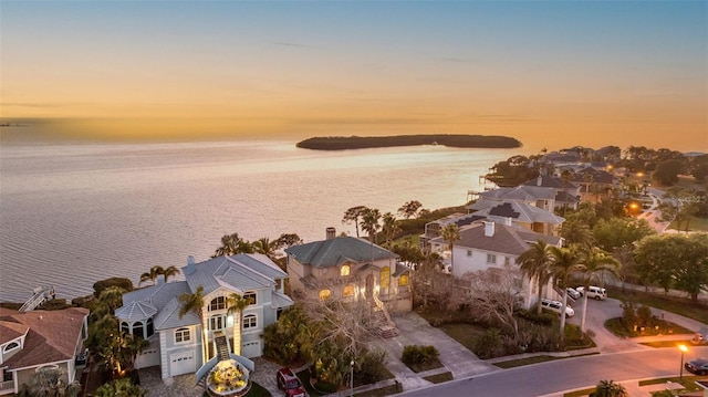 birds eye view of property featuring a residential view and a water view
