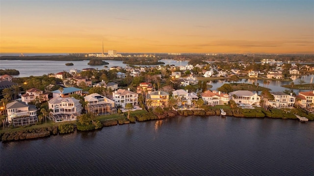 bird's eye view with a residential view and a water view