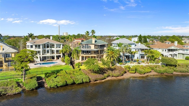 drone / aerial view featuring a water view and a residential view