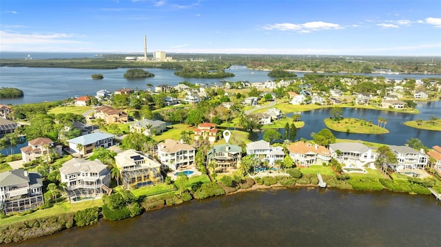 drone / aerial view featuring a residential view and a water view