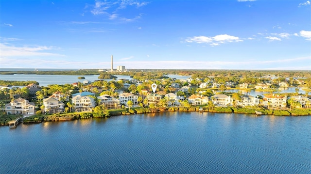 birds eye view of property with a residential view and a water view