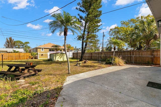 view of yard with a patio and a fenced backyard