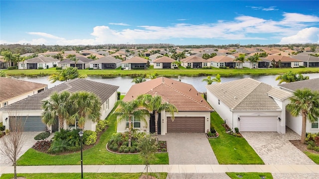 birds eye view of property featuring a residential view and a water view