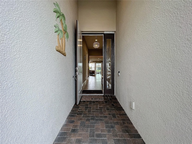 view of exterior entry featuring stucco siding