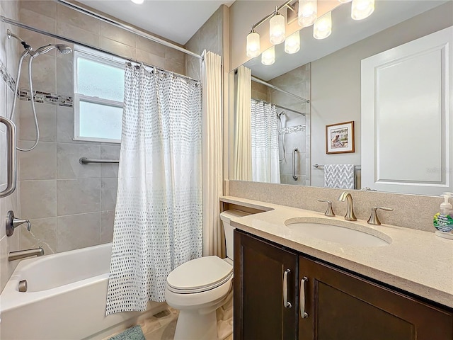 full bath with shower / bath combo, vanity, and toilet