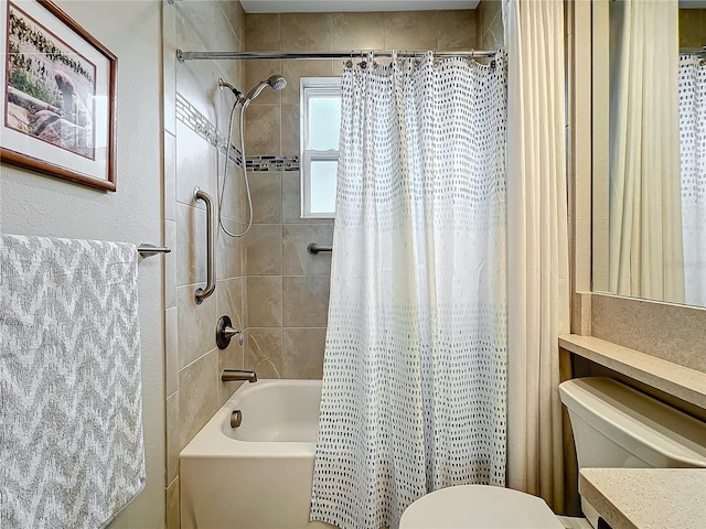 bathroom featuring vanity, shower / tub combo with curtain, and toilet