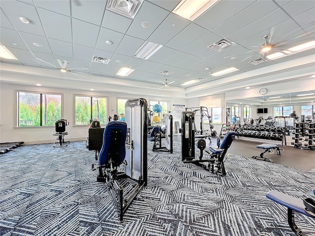 workout area featuring visible vents, carpet, and a drop ceiling