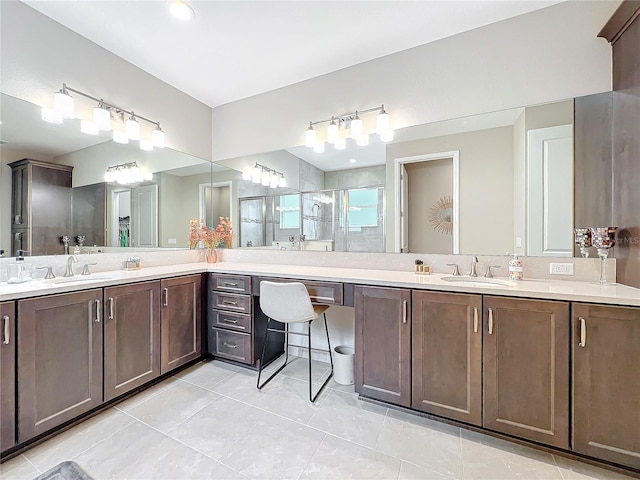 bathroom with vanity, tile patterned floors, and a stall shower