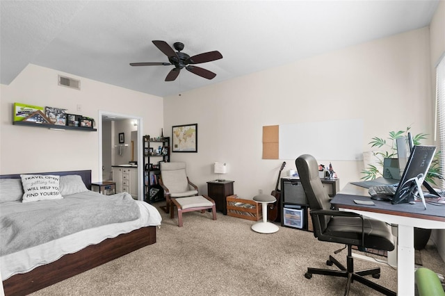 carpeted bedroom with ceiling fan and connected bathroom