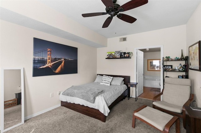 carpeted bedroom with ceiling fan and ensuite bathroom