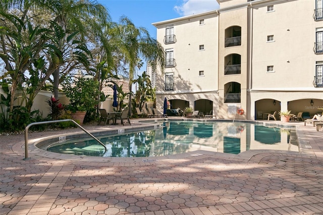 view of pool featuring a patio