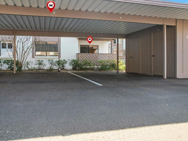 view of parking with a carport